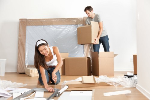 Removal team loading boxes for a same day move in Acton