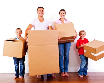 Furniture being carried down stairs during an urgent Acton relocation