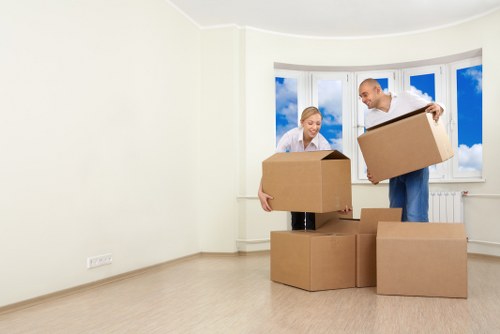 Furniture and boxes being moved with a removal truck in Acton
