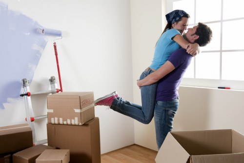 Packed moving boxes and furniture ready for removals in Acton