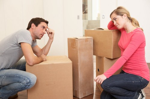 Packed boxes and furniture prepared for a removal van move in Acton