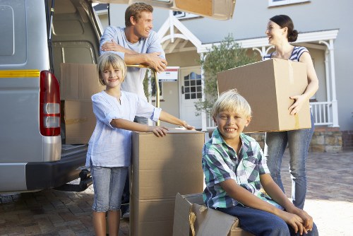Careful loading of sofas and tables for a local move in Acton