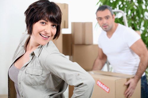 Protective wrapping and safe lifting for a piano removal service