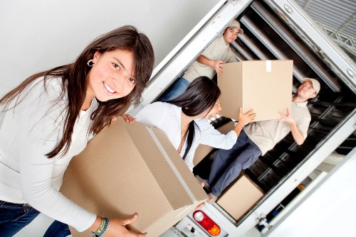 Loading household items into a removal van in Acton