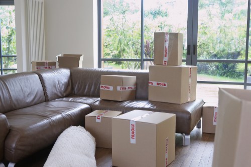 Packed boxes and wrapped household items ready for a flat removal