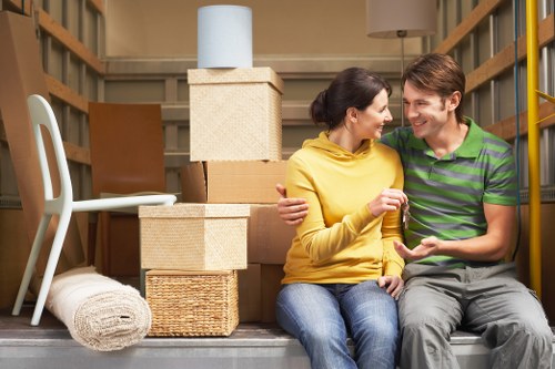 Driver and helper handling furniture during a removal job